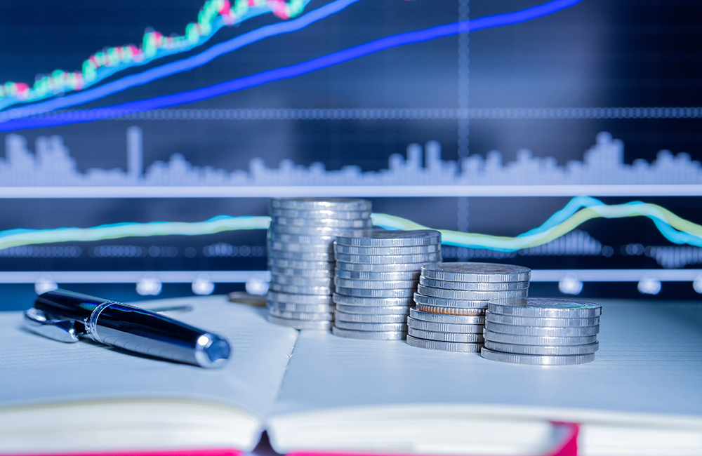 Stack of money coin with trading graph. Stack of money coin with trading graph. financial investment concept use for background.